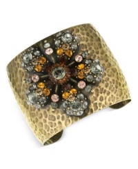 A bouquet of bohemian flowers. This bracelet from 2028 features a textured cuff displayed a flower accent with topaz and black diamond crystals. Crafted in burnished brass. Approximate length: 7-1/4 inches.