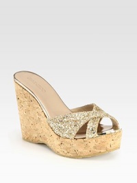 Raise the bar wearing this glittery staple with elegantly crisscrossed straps and a powerful cork wedge. Cork wedge, 4½ (115mm)Cork platform, 1½ (40mm)Compares to a 3 heel (75mm)Glitter-coated fabric and metallic leather upperMetallic leather liningRubber solePadded insoleMade in Spain