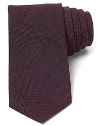 Cut for a modern silhouette, this solid narrow tie spruces up your look no matter where you go.