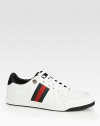 Lace-up sneaker with signature web and logo label on the tongue.Rubber soleMade in Italy