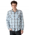 Get that laid-back look that is all casual cool with this weathered plaid shirt from Calvin Klein Jeans.