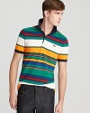 A festive stripe design adorns this cotton pique polo, a vivid shirt that brightens up your casual look.