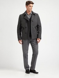 A double-breasted outerwear silhouette crafted in a superior wool blend, featuring leather pocket detailing for a uniquely tailored finish.Button-frontWaist slash pocketsFully linedAbout 27 from shoulder to hem80% wool/20% polyamideDry cleanImported