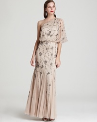 This light-as-air Adrianna Papell one-shoulder gown is splashed with sparkling sequin clusters for an ultra-glam finish.