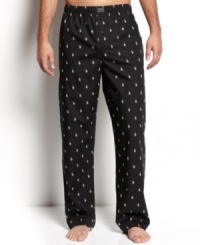 This soft cotton pant is a simple luxury that you should not be without. Relaxed fit with elastic waistband and single button fly. Polo player print all over. Logo appliqué at front waistband.