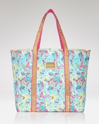 Your passport to style, this Lilly Pulitzer tote travels through time with a sparkling print saluting decades of design.