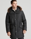 A bold defense against the bitter cold, this goose down-filled jacket keeps you warm and dry despite the elements, and is fashioned with a fur-trim hood for a little dose of luxury. From Moorer.