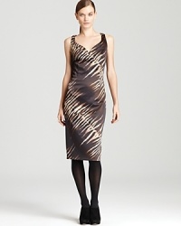 Exotics go executive as statement animal print enlivens an alluring BASLER sheath dress. Put a shine on the sleek style with silver accents for a sophisticated walk on the wild side.