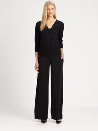 Beautifully beaded, this merino wool sweater features a feminine, draped neckline and modern elbow-length sleeves.Draped necklineElbow-length sleevesPull-on styleAbout 24 from shoulder to hemMerino woolDry cleanImported of Italian fabricSIZE & FIT Model shown is 5'10½ (179cm) wearing a US size Small. 