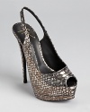 Snakeskin embossed leather sits atop a towering heel on these show-stopping Giuseppe Zanotti Sharon slingbacks.