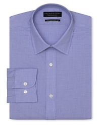 Dress shirt with spread collar, two button barrel cuffs and a contemporary fit through the body, with a blue check pattern.