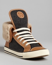 Tory Burch offers this luxe, fun take on the sneakers-meets-fashion trend with these high tops lined in plush shearling.