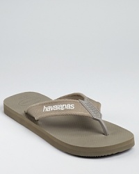 Experience the comfort and freedom on this comfy sandal, from Havainas. It's crafted from tough, textured rubber and a comfy canvas strap with logo detail.