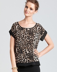 A lightweight Aqua tee is updated with leopard print for a fierce look with playful spirit.