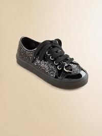 Sparkle and shine in a comfy sneaker, covered with sequins and accented with shiny patent.Faux leather and faux patent upper with sequinsLace-up front with heart charmFaux leather liningPadded insoleRubber composite soleImported