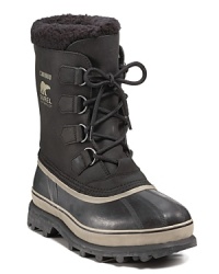 This rugged all-weather boot from Sorel keeps you warm and dry under any conditions, with a rubber shell toe and sides, waterproof leather upper and cozy sherpa cuff.