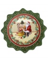 Feel like a kid on Christmas with the Toy's Fantasy pastry plate from Villeroy & Boch. Fine porcelain in a playfully ruffled shape features a beautiful illustration of Santa and his sleigh trimmed with intricate patterns and classic toys.