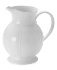 Scalloped detail adds a touch of texture to the simply elegant Antique White pitcher by Mikasa. Ultra-durable porcelain is equally suited for formal dinner parties and every day.