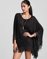 Be the head poncho in this fringed style from, L*Space, boasting a breezy silhouette and bohemian detailing. It's a splashy way to take cover.