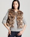 Indulge yourself in the ultra-luxe warmth of this chic fur Theory vest.