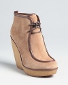 On-trend chukka styling gets a major lift in these KORS Michael Kors booties, which are sure to become a weekend staple.