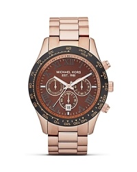 High impact accessories are on our radar. Perfect the look with this over sized rose gold watch from MICHAEL Michael Kors, featuring chronograph movement and a superfine sun-ray dial.