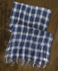 Layer your ensemble with a plaid wool scarf for added warmth and rugged downtown style.