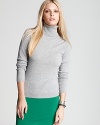 The ideal contrast to of-the-moment printed pants and colored denim, this C by Bloomingdale's turtleneck flaunts a classic silhouette in sumptuous cashmere for instant chic.