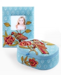 Stitched with colorful birds and delicate blooms, Purva's aqua picture frame and jewelry box accent the bedroom with boho charm.