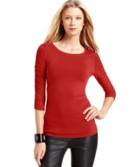 The fitted silhouette of Vince Camuto's scoopneck top is highlighted by ruched details down the sleeves and at the sides.