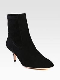 This on-trend suede ankle boot has a back stretch panel for superior comfort. Self-covered heel, 2¾ (70mm)Suede upper and stretch suede back panelPull-on styleLeather lining and solePadded insoleImportedOUR FIT MODEL RECOMMENDS ordering one half size down as this style runs large. 