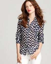 Take a break from the solid button down and take your look to print with this Milly chevron shirt boasting smart epaulets and a sheer texture for the perfect pairing to summer's crisp white jeans.