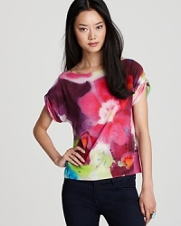 Alice + Olivia demonstrate flower power in a stretch silk top that blooms all season long.