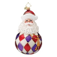 A jolly Santa Claus ball ornament in harlequin dress with gold rope ties.