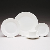 This eclectic service with its beautifully-detailed basket-style relief is an everyday white china for those who appreciate the unique. Bone china.