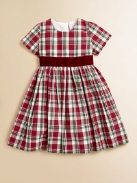 Adorned with a festive plaid print and velvet tie, this gorgeous cotton frock will make your little girl feel like a sugarplum fairy.ScoopneckShort sleevesBack buttonsWaistband with velvet ribbon tieFull skirtFully linedCottonDry cleanImported Please note: Number of buttons may vary depending on size ordered. 