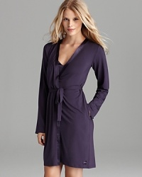 Wrap yourself in a soft long sleeve robe with contrast silk trim from Calvin Klein. Style #S2454