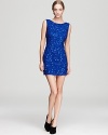 Short, sweet and sequined, this ABS by Allen Schwartz mini dress makes a standout exit with a low, scooped back.