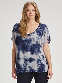 This tie-dye top might just be your new go-to style. It features an alluring v-neckline and a laid-back fit. Straight-leg jeans or skinnies would really complement this design.Deep v-neckShort sleevesRelaxed fitPull-on styleAbout 28 from shoulder to hemRayonMachine washMade in USA