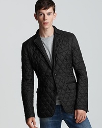 A sophisticated quilted sport coat from Burberry London elevates your look to one of timeless appeal.