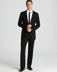 Appointed with classic details, this fine tuxedo suit makes a strong impression at all your black tie affairs. Take the dance floor with authority or raise your glass and make a toast with the quiet confidence that comes from looking sharp.