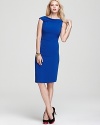 Evoke modern elegance in this Rachel Roy sheath dress flaunting a curve-enhancing silhouette and feminine cowl neckline. Garnish with gold accents and captivate from the corner office to cocktail hour.