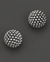 Studded ball earrings with signature Caviar™ beads in sterling silver finished with gold posts. Designed by Lagos.