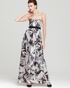 A floral print with shimmering metallic accents is showcased on a strapless silhouette from BCBGMAXAZRIA.