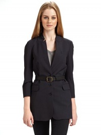 THE LOOKNotched collar Three button front ¾ sleeves with five button cuffs Single welt pocket at chest Leather belt with buckle and belt loopsTHE FITAbout 28 from shoulder to hemTHE MATERIAL96% wool/4% Lycra spandex Fully linedCARE & ORIGINDry clean Imported