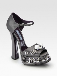 Mary Jane platform silhouette rendered in Italian satin with ornate beading and a classic peep toe. Self-covered heel, 5¾ (145mm)Covered platform, 1¾ (45mm)Compares to a 4 heel (100mm)Satin upper with rhinestone and beaded embellishmentPeep toeAdjustable ankle strapLeather lining and solePadded insoleMade in Italy