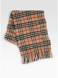 Iconic plaid design enhances this luxurious winter staple.Fringed edgesAbout 13W x 61LCashmereDry cleanImported