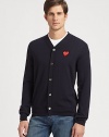 Cozy wool v-neck with a button-down front and vibrant heart emblem. V-neckButton frontLong sleevesWoolDry cleanImported