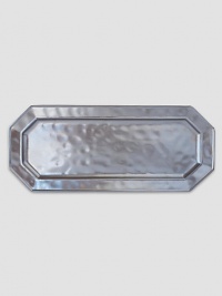 A unique mottling technique lends a hand-thumbed, hammered design to a beautiful metallic pewter serving tray with the look of an old-world favorite. 7¾W X 18L Dishwasher safe Imported