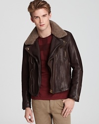 A forever classic, the leather bomber jacket with a shearling collar, expressively masculine and ruggedly refined, with distinctive designer appeal from Burberry Brit.